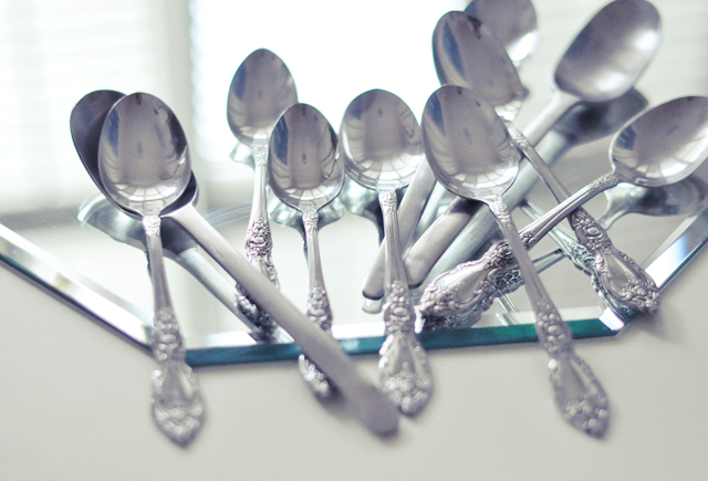 silverware with forks and spoons arranged into the shape of a heart
