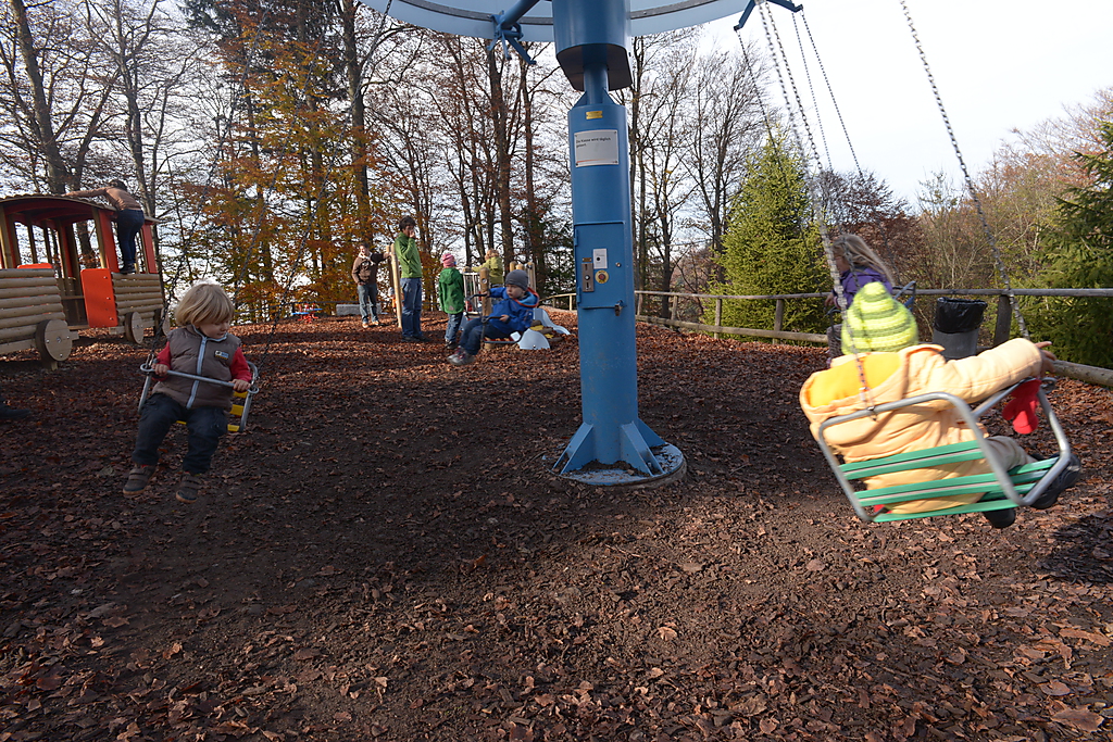 a playground in the park is set up with children playing