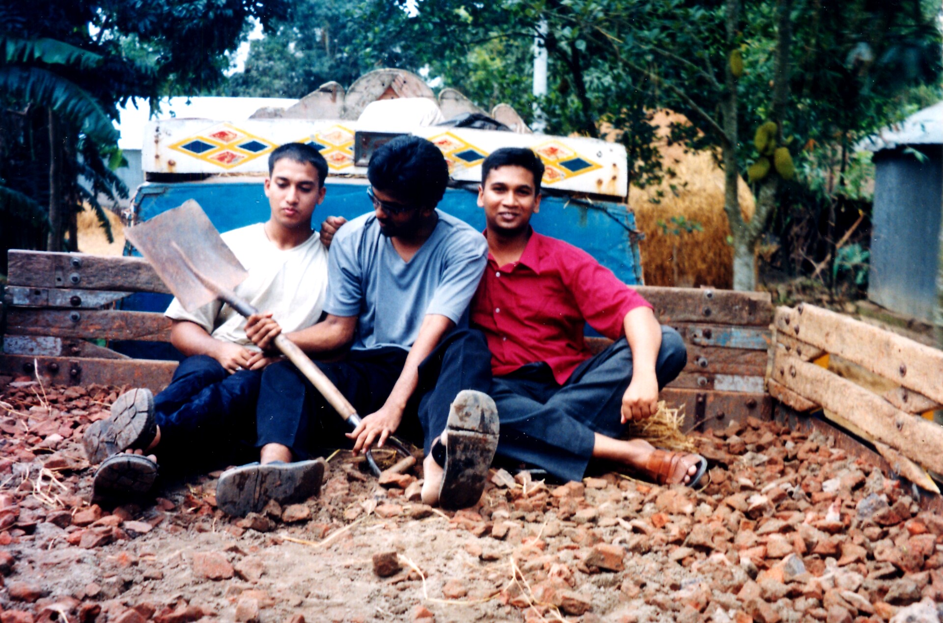 a group of people are sitting in a pile of rubble