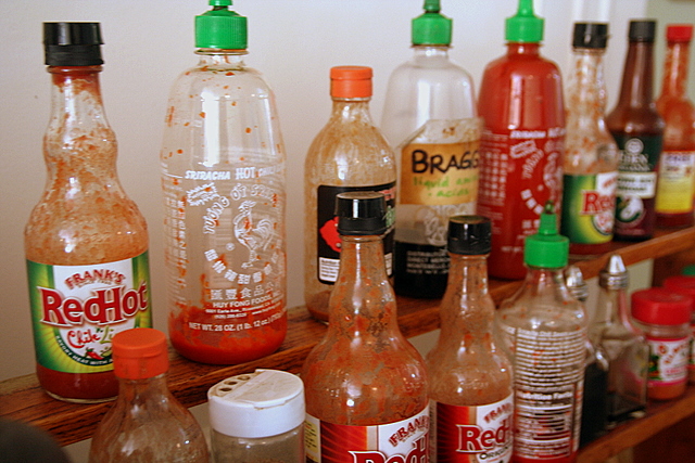 an assortment of asian food and drinks on a counter