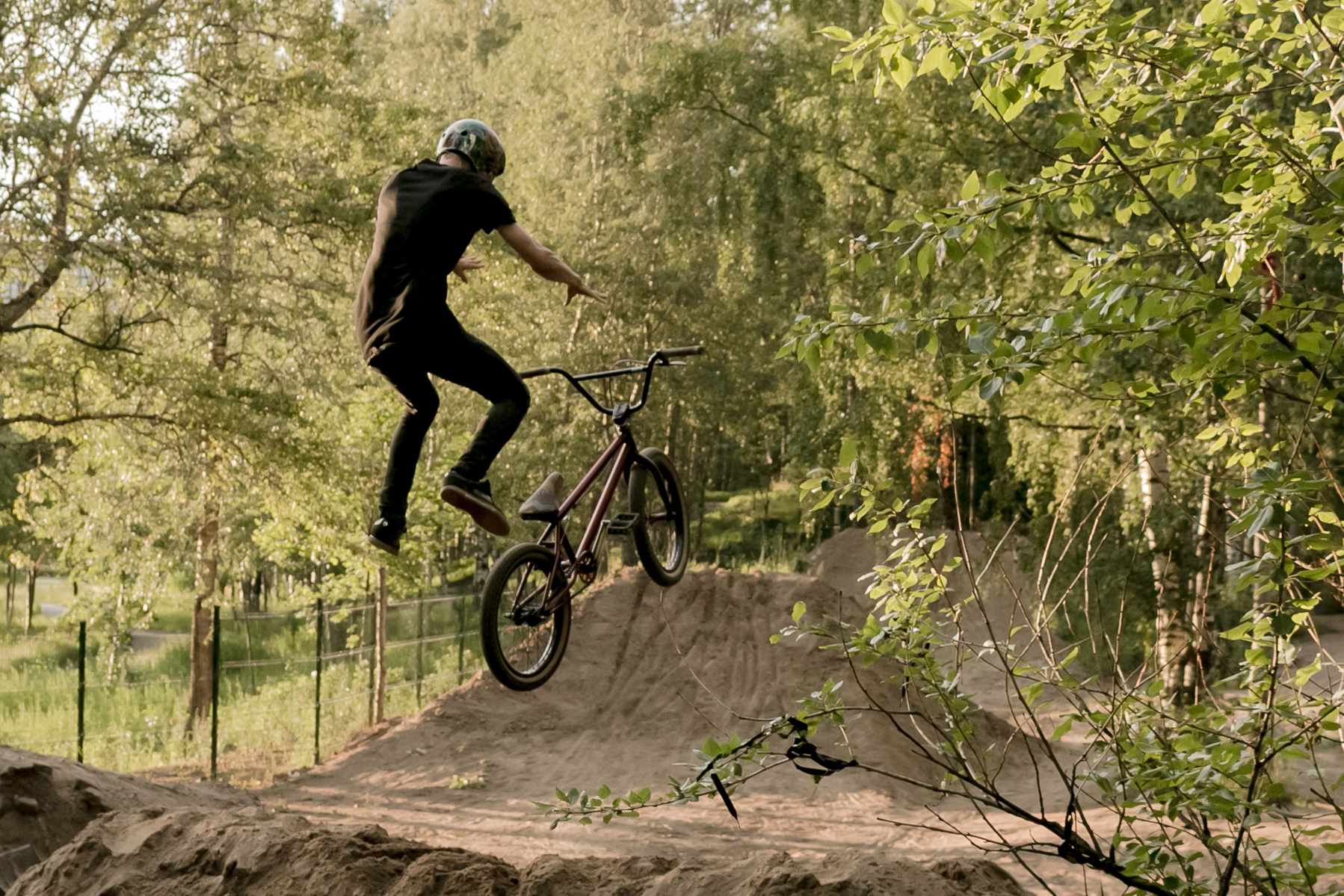 a man riding his bike up the side of a ramp