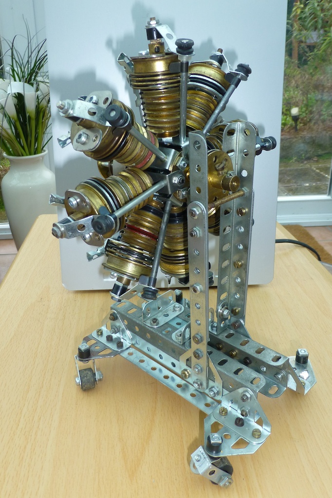 a clock made out of multiple gears on top of a table