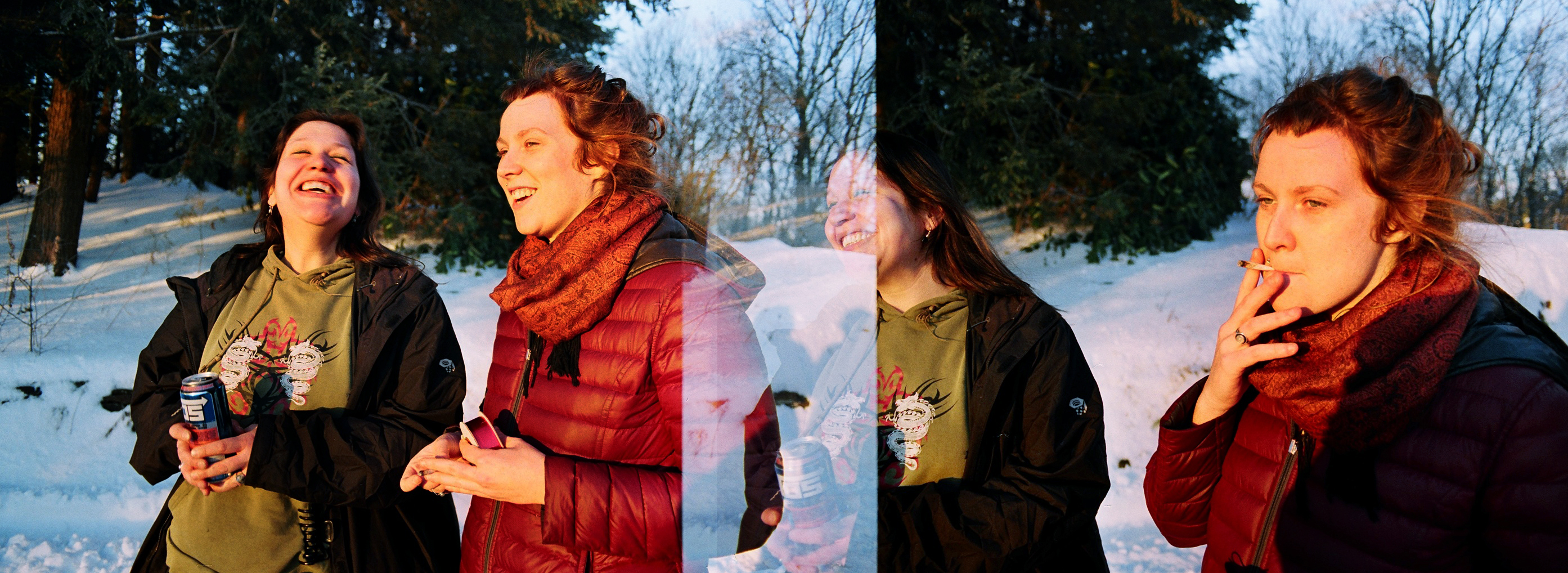 a woman with a large  is standing in the snow drinking from a water bottle