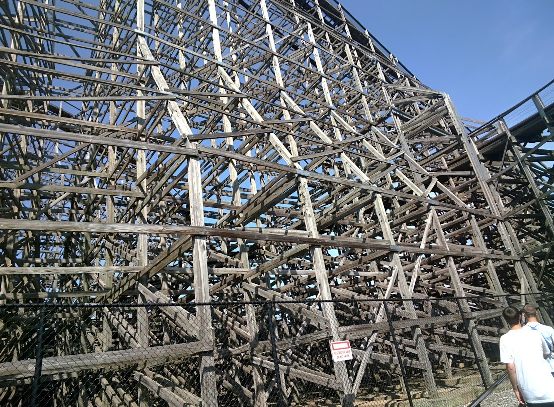 a large metal structure sitting on the side of a street