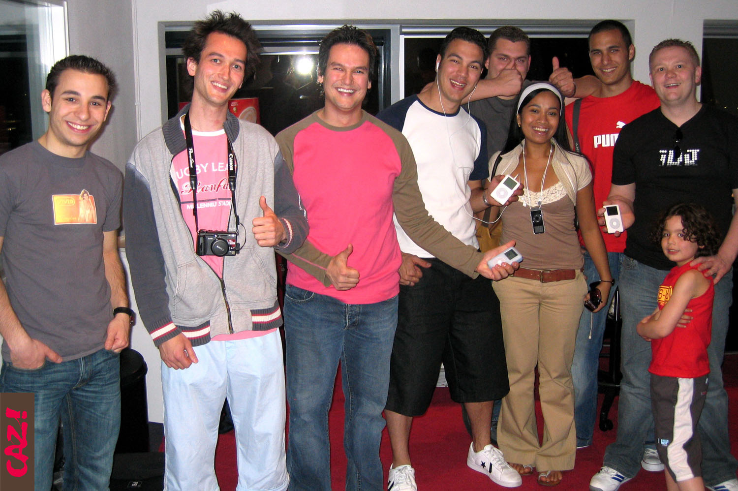 people are posing for a group po in a living room