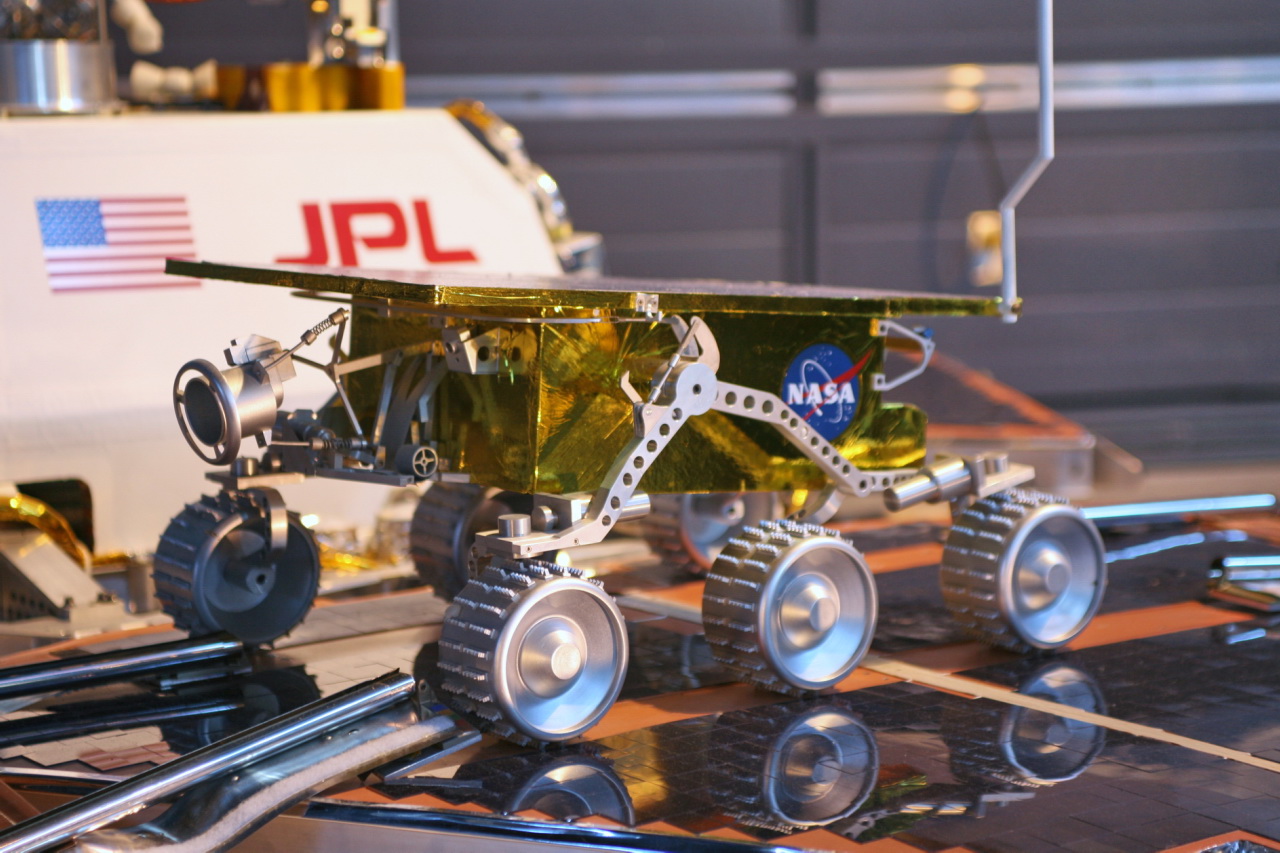 a space vehicle with wheels and the space station insignia