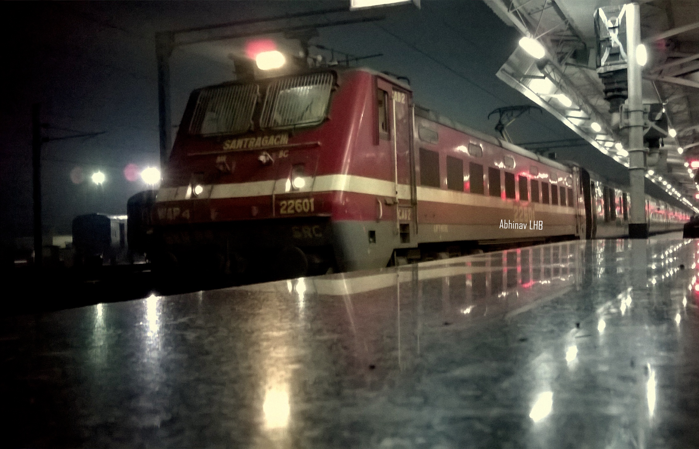 a train stopped at the platform for some passengers to board