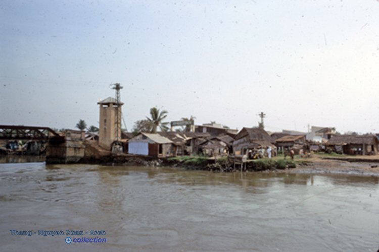 an old po of a village on a river