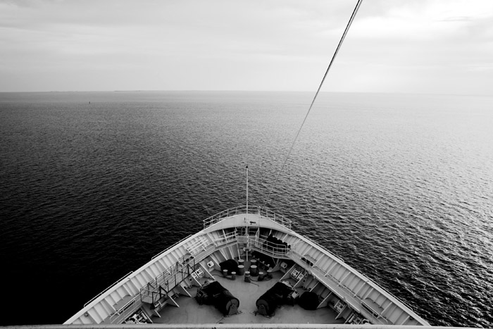 a large ocean with the view from the deck of a boat