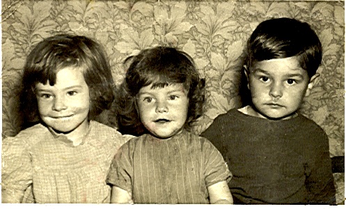 an old po of three boys with faces missing