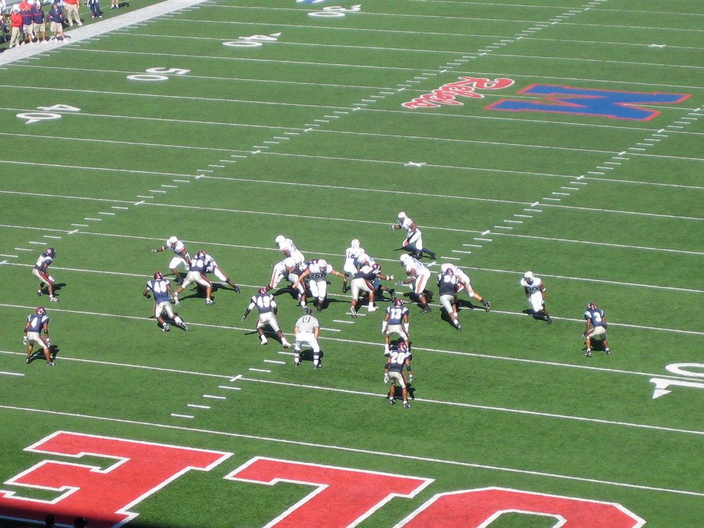 an overhead view of football players in the middle of a play
