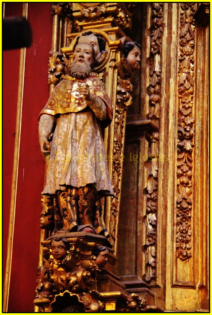 a statue of saint benedict with the cross of jesus
