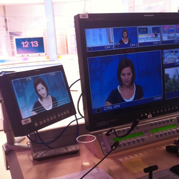 two televisions are shown with different headsets on them