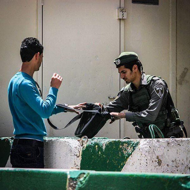 police officers on duty helping a man with his bag