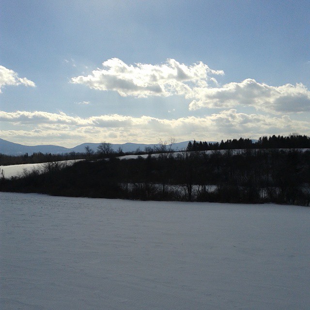 a view of some snow and mountains from a distance