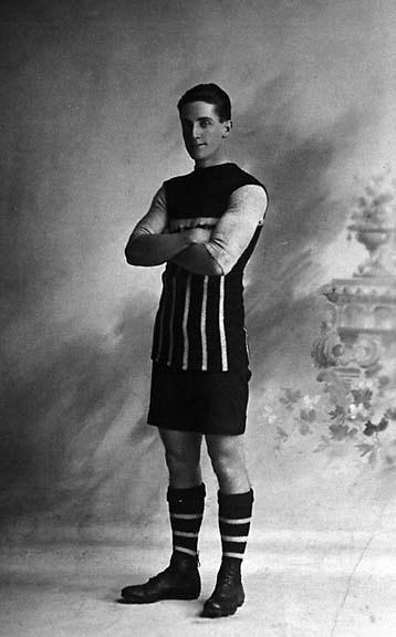 a man in an old time po with soccer socks