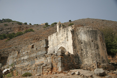 a big stone building sitting on top of a mountain