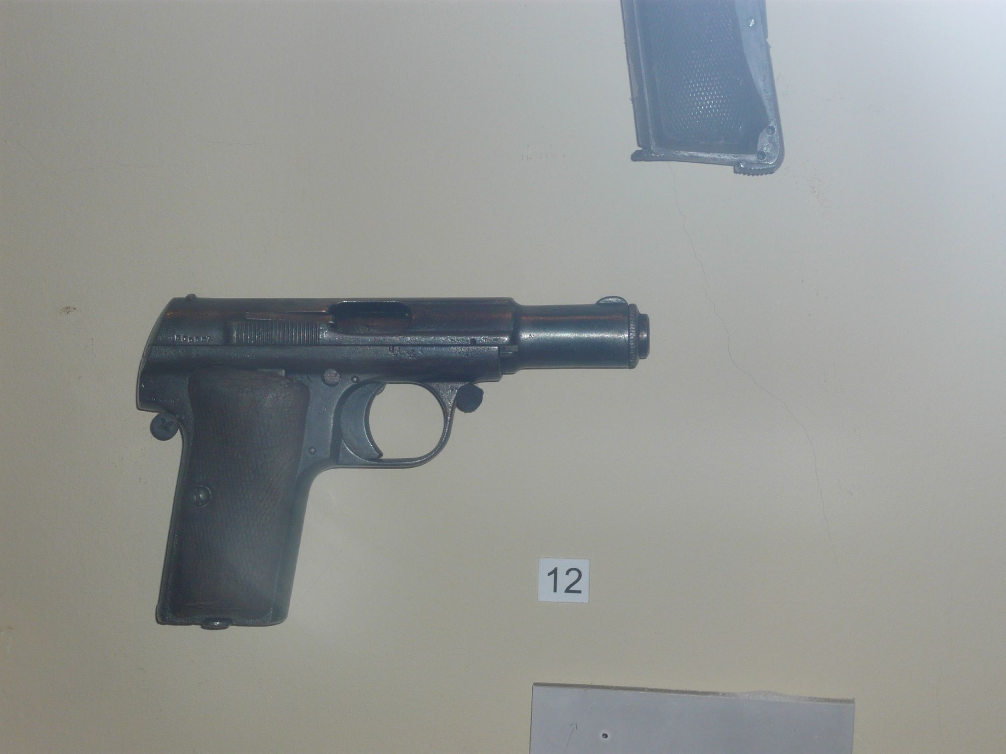 a display with several guns for sale and prices