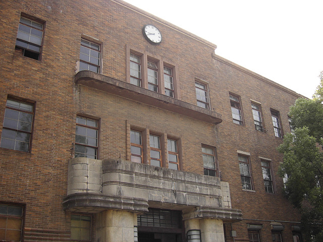 an old building that has a clock on the side