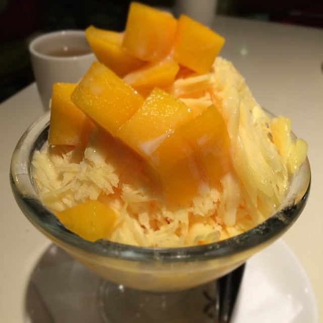 the dessert includes oranges and cream on top