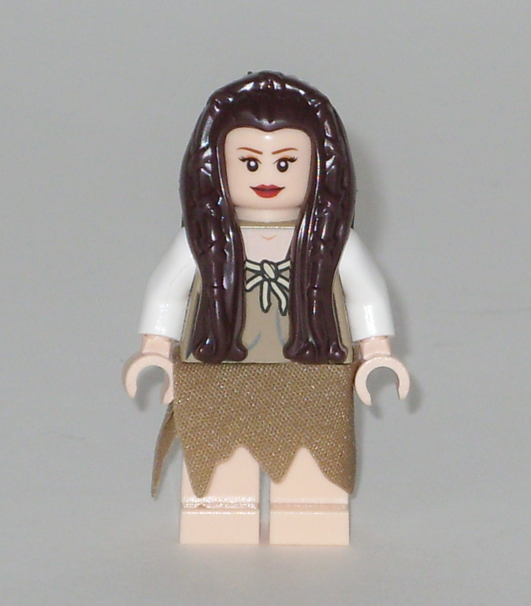 a close up of a lego woman with a skirt on