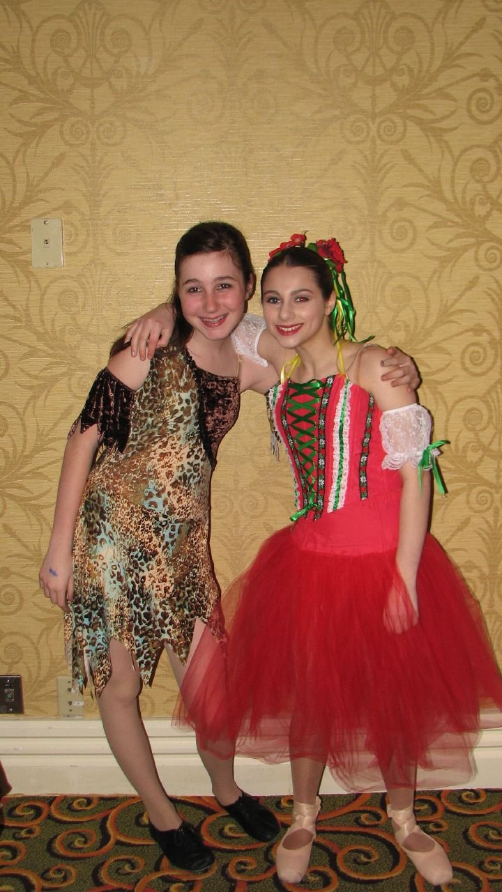 two s dressed up in costumes and posing for the camera