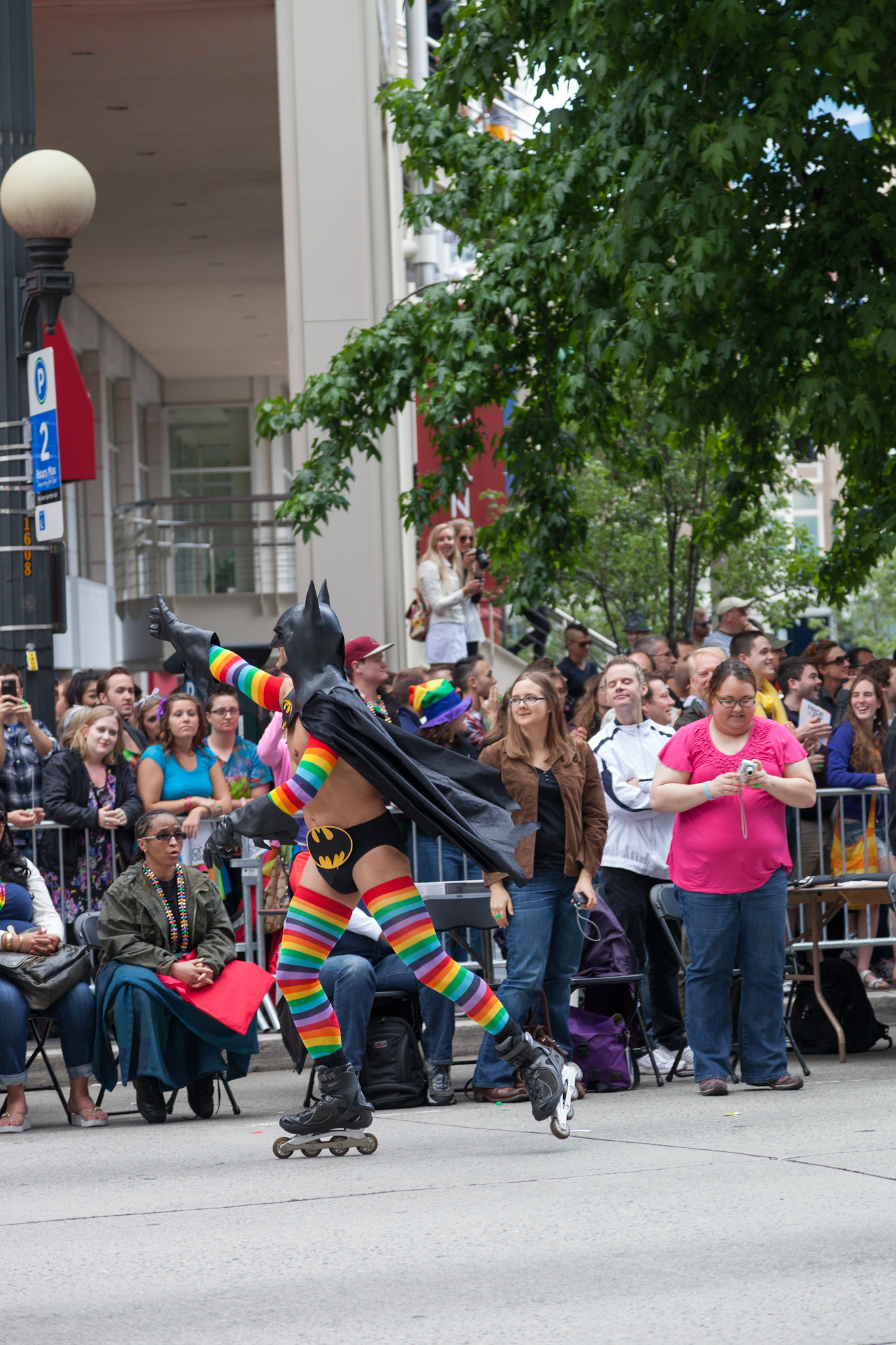 a person riding a skate board in a parade