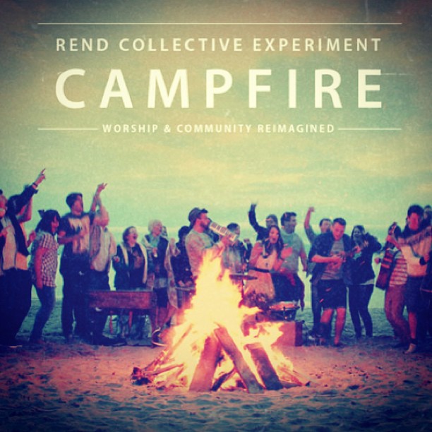 a bonfire with people standing around it and the words campfire