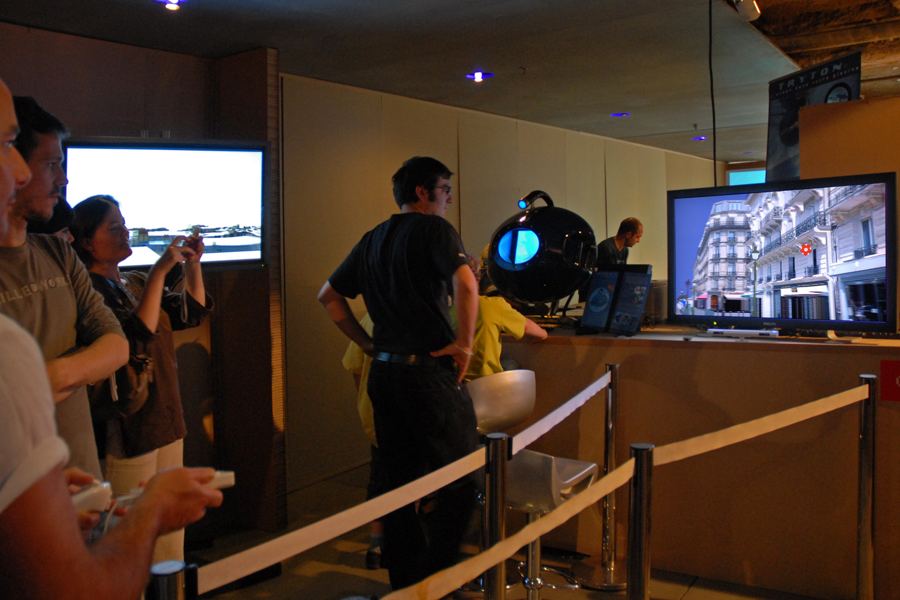 people are looking at a screen showing the inside of an airport