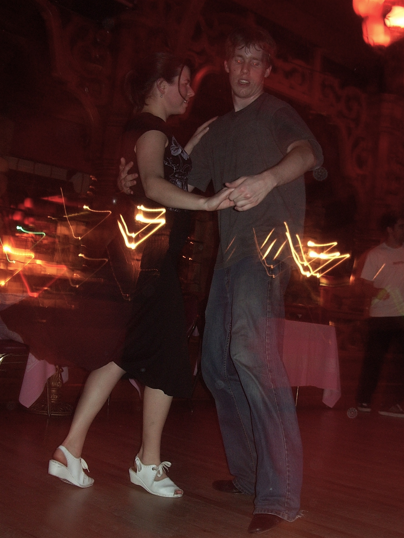 a couple is dancing at a party