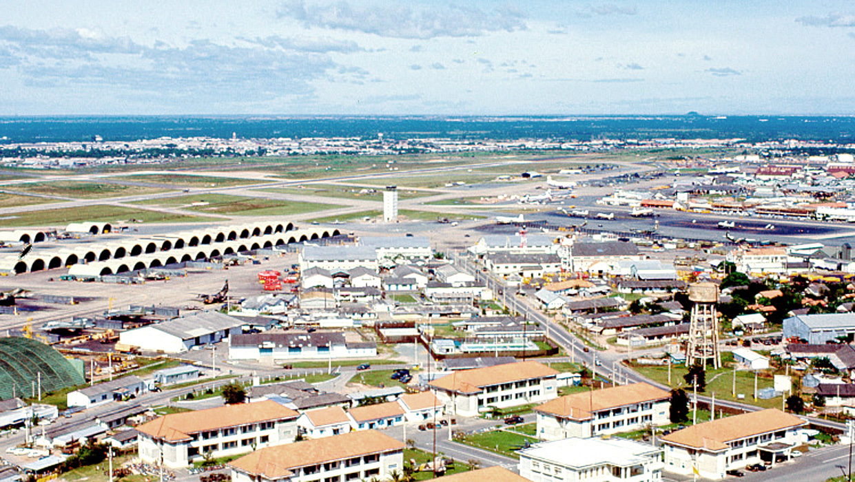 an overhead view of a city with a train station