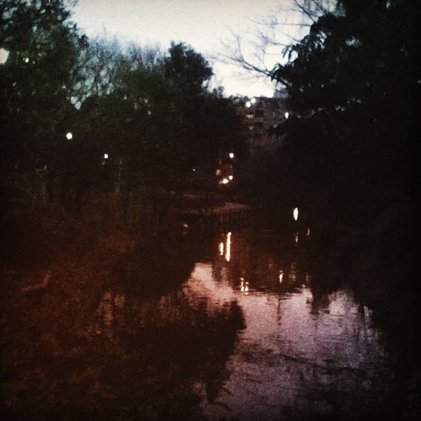 a very blurry and dark scene of a river