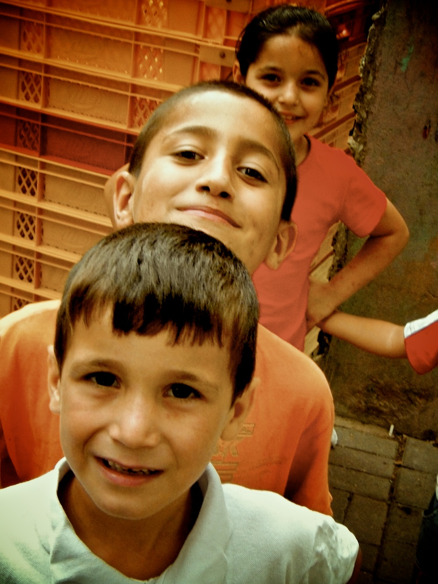 a group of boys are standing around each other