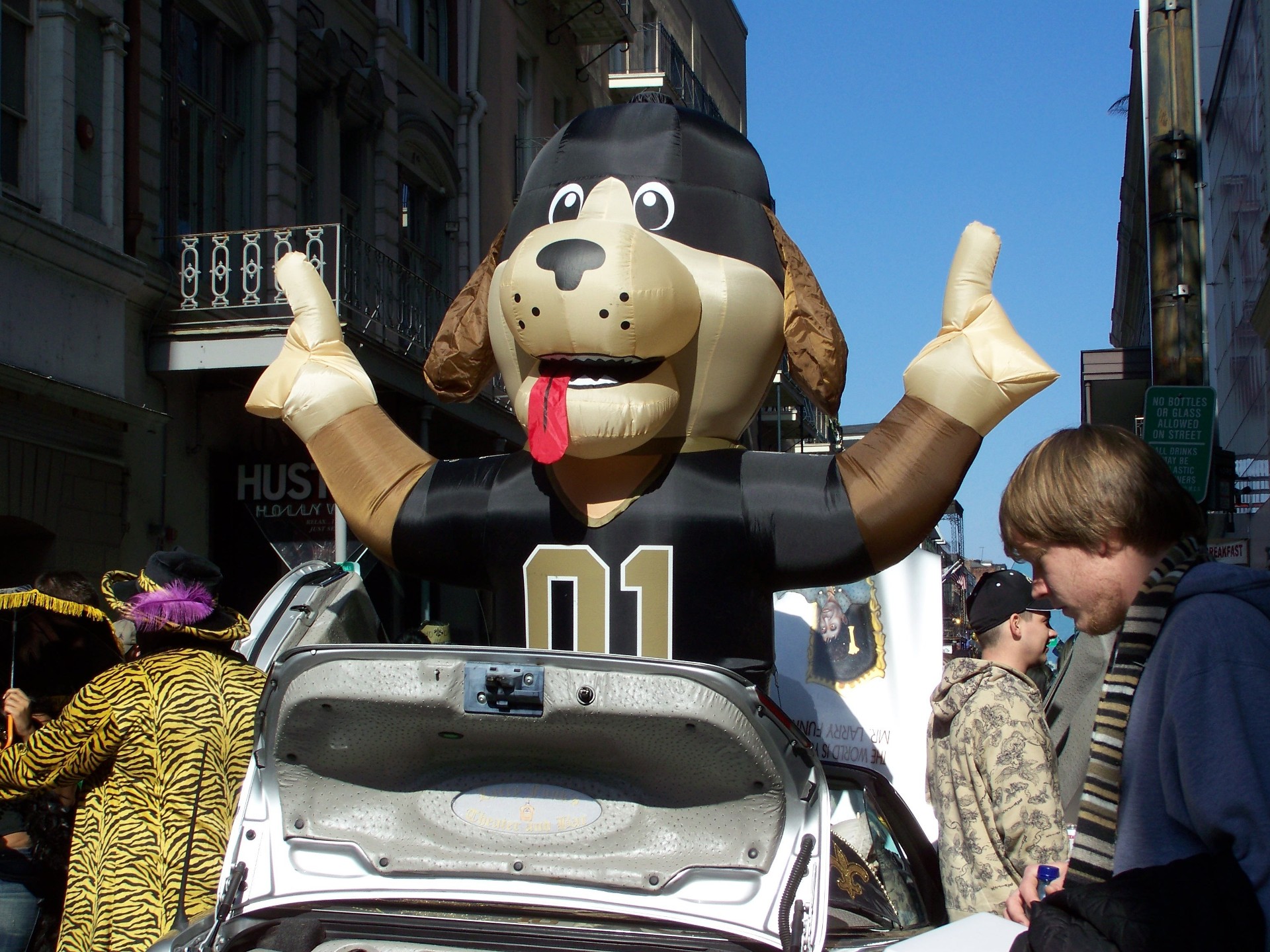 a dog float in a parade down the street