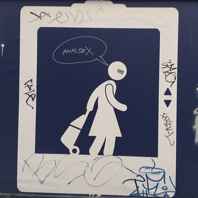 the drawing depicts a person with a suitcase