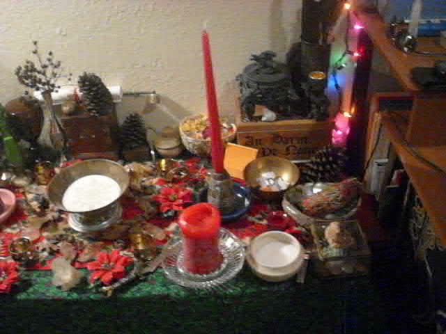 a table covered in christmas decorations and candles