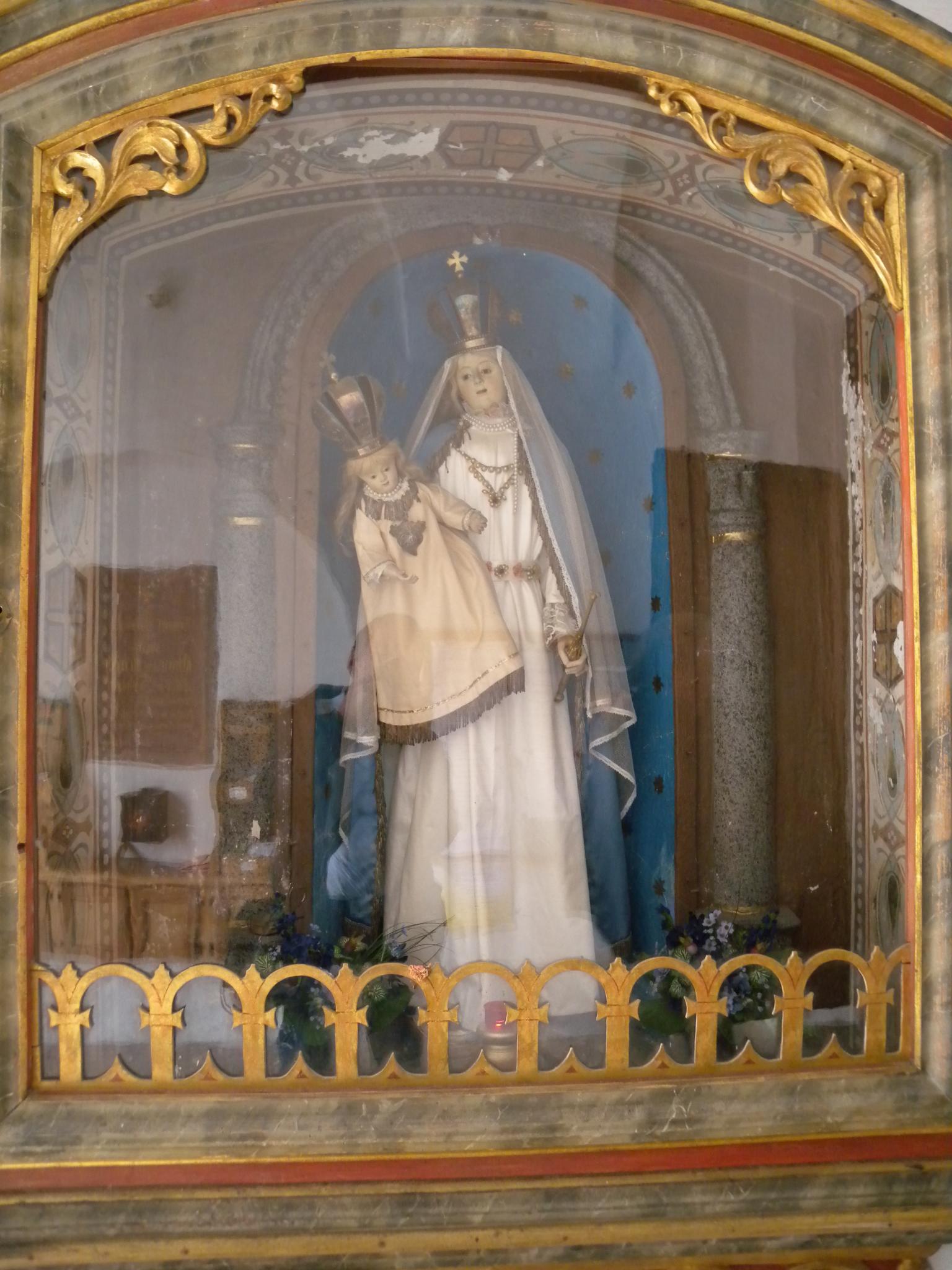 a statue of an catholic man in a shrine