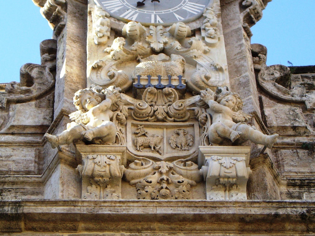 the clock is attached to an old stone building