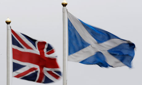 the two flags of britain and scotland are flying side by side