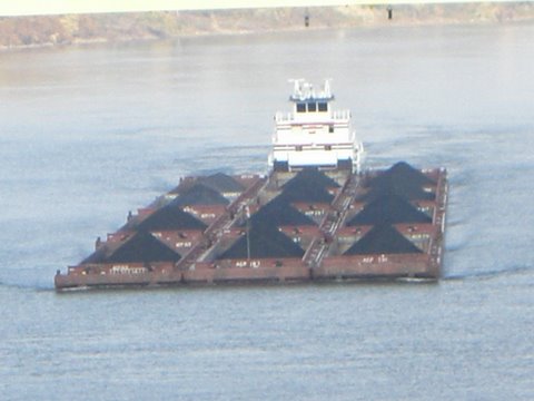 a large boat in the water with some cargo on it
