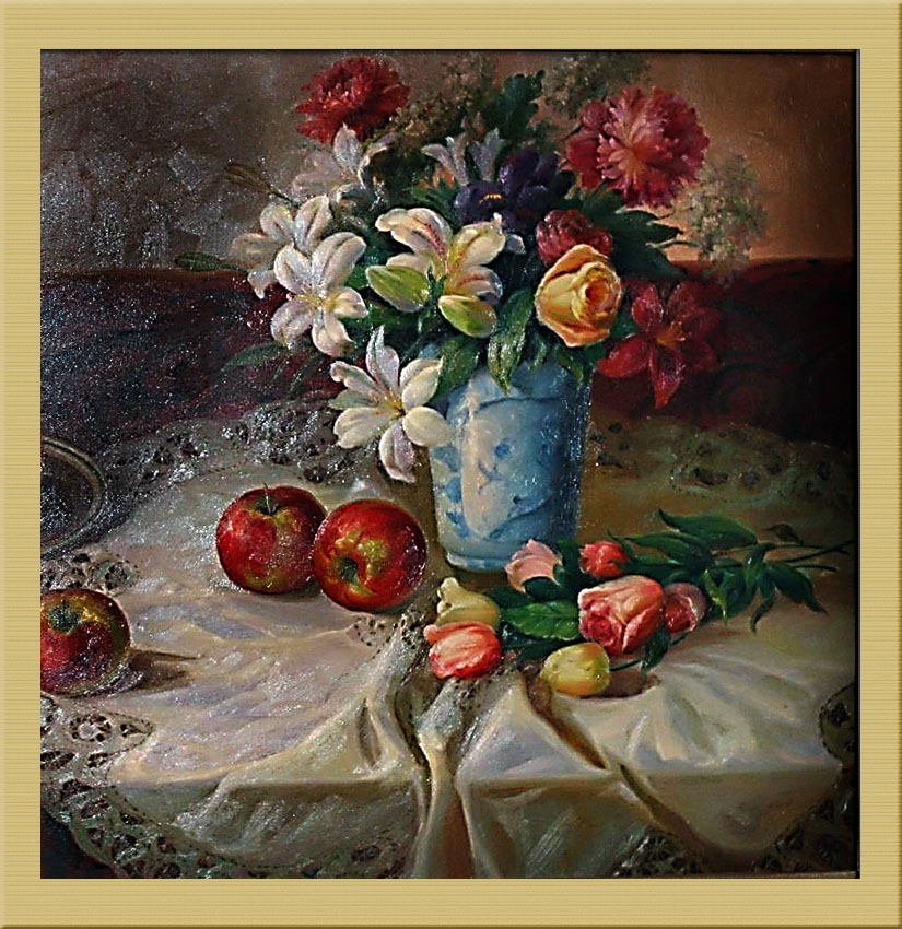 flowers and fruit on a table with a cloth