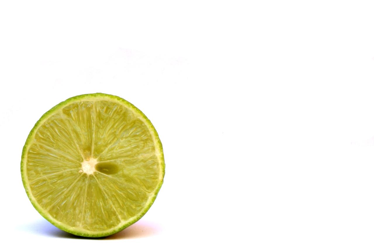 the half of a lime has been cut into slices
