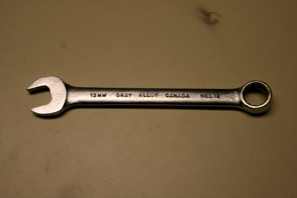 a wrench with the words low gas corona in it