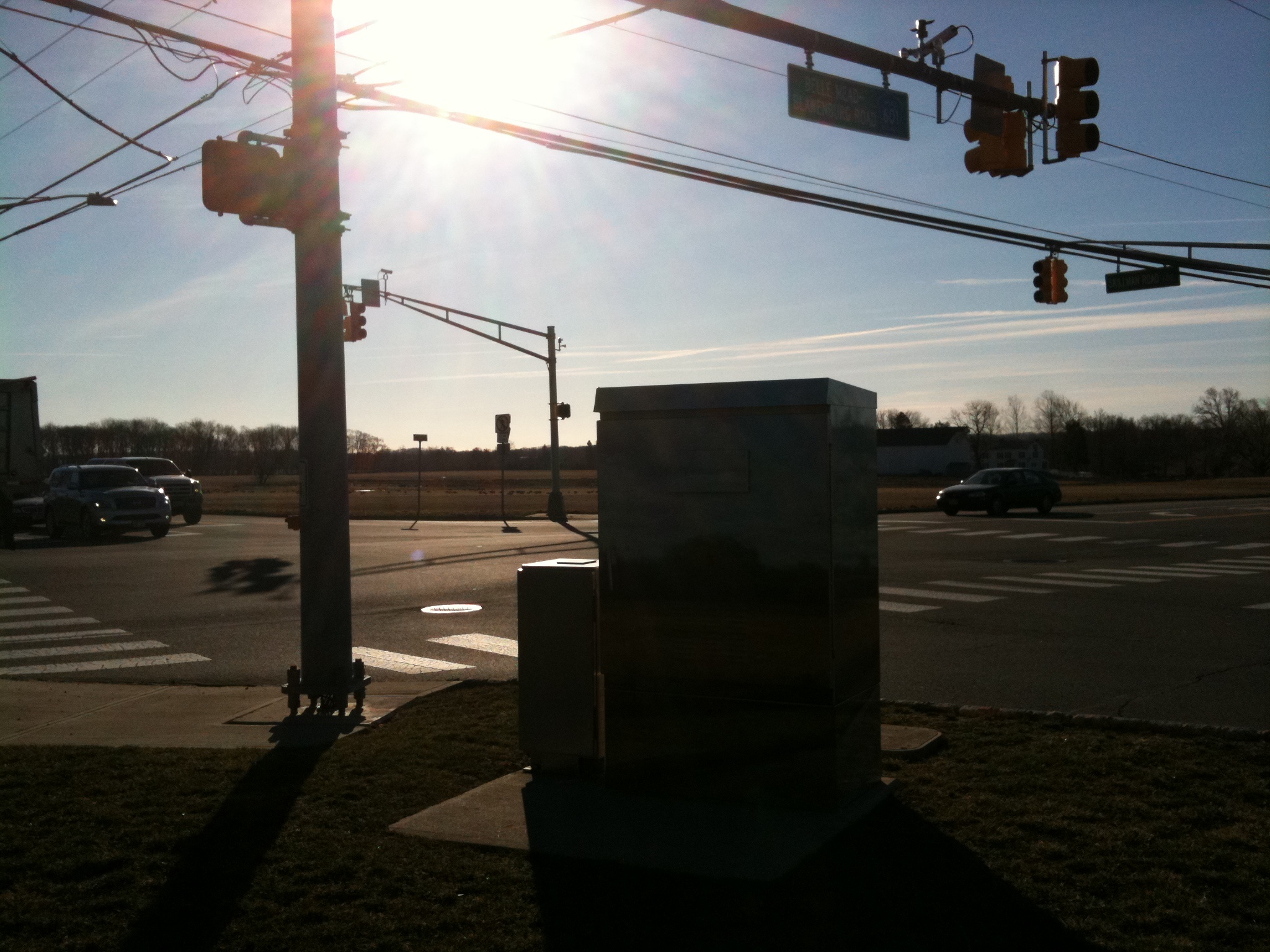 the sunlight shines on the horizon of the city intersection