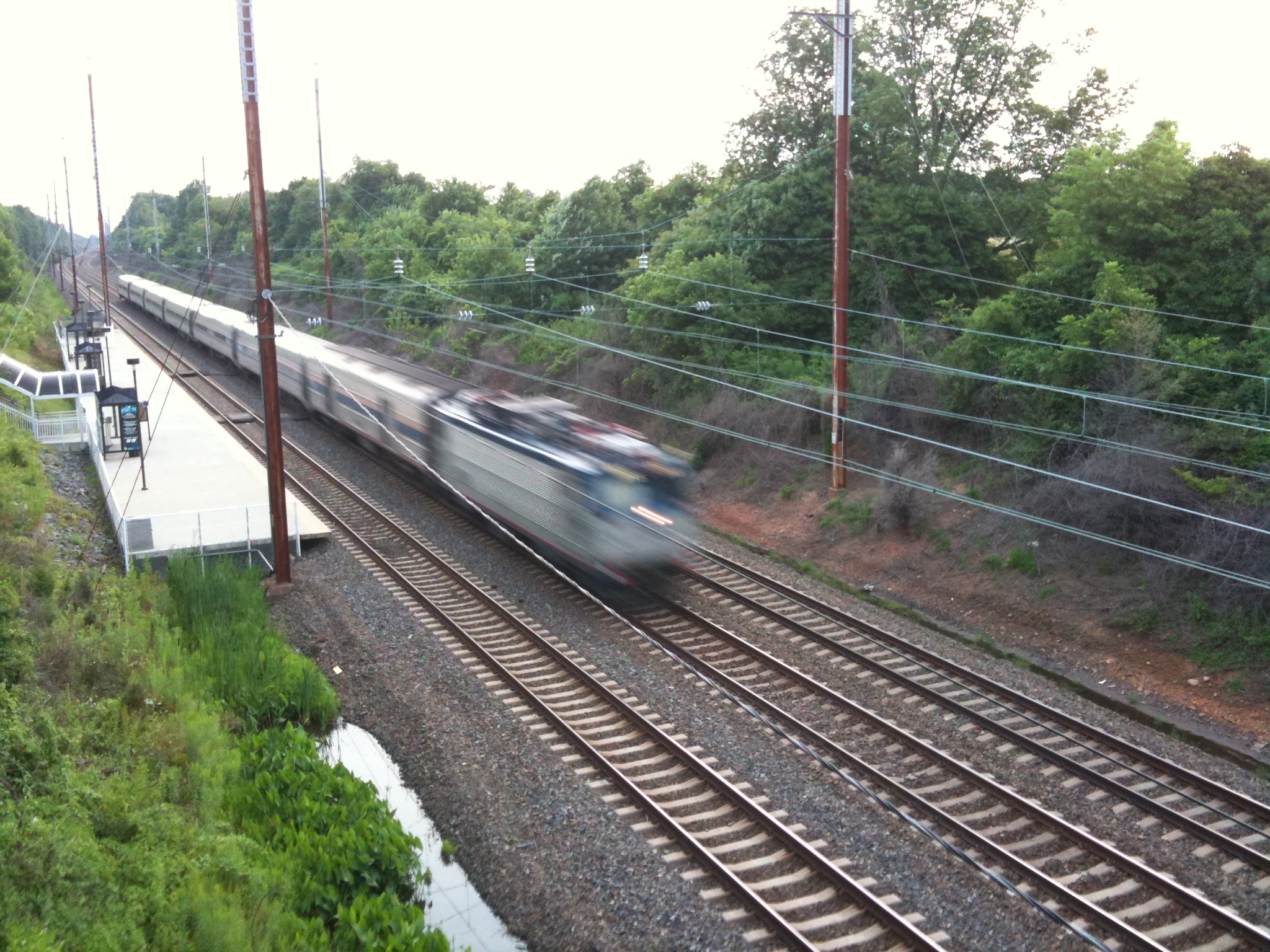 a train traveling along the tracks in an urban area
