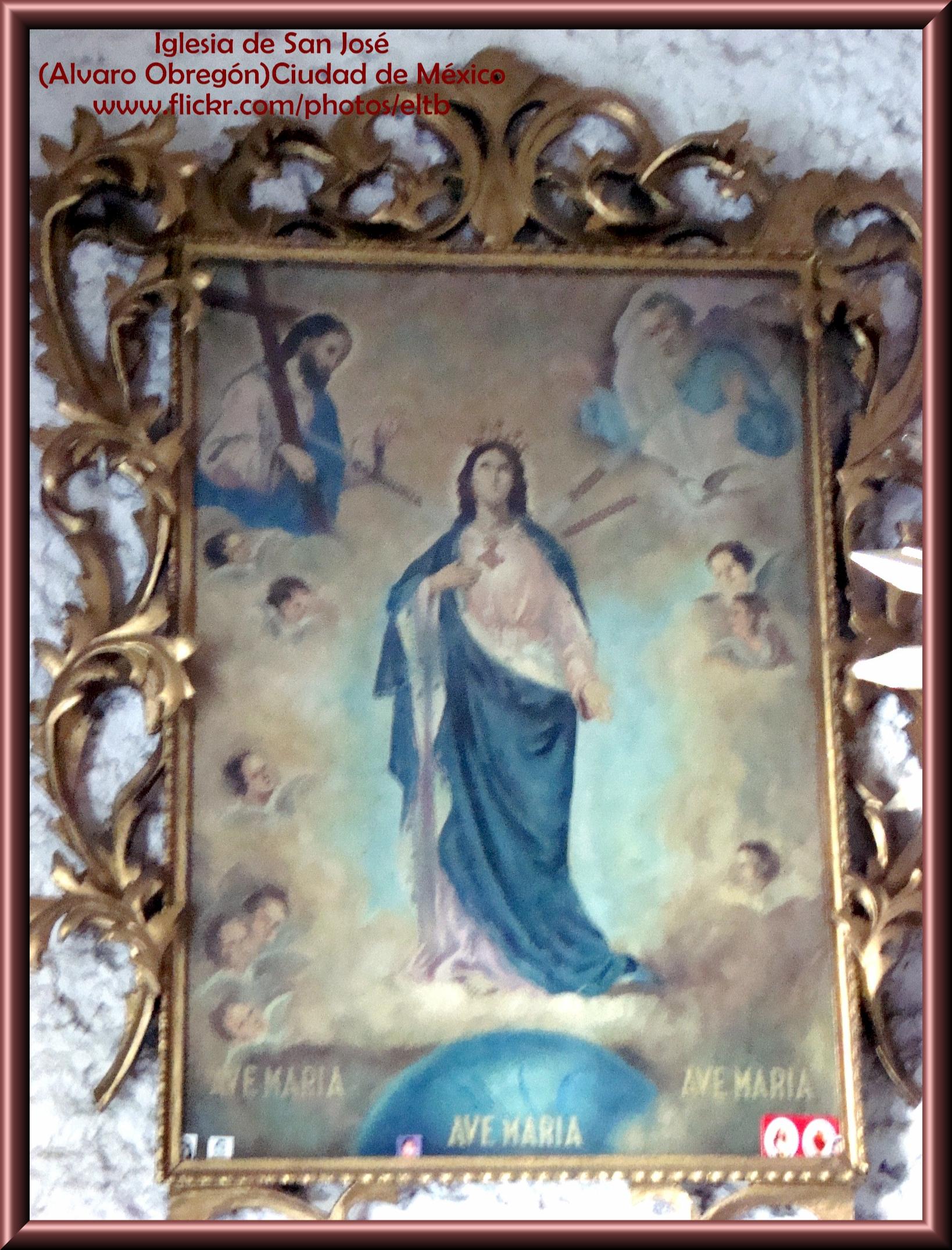 a gold framed painting of a religious figure