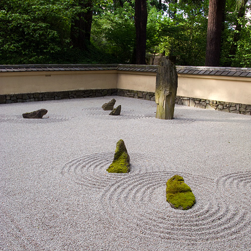many rocks are placed on the white ground