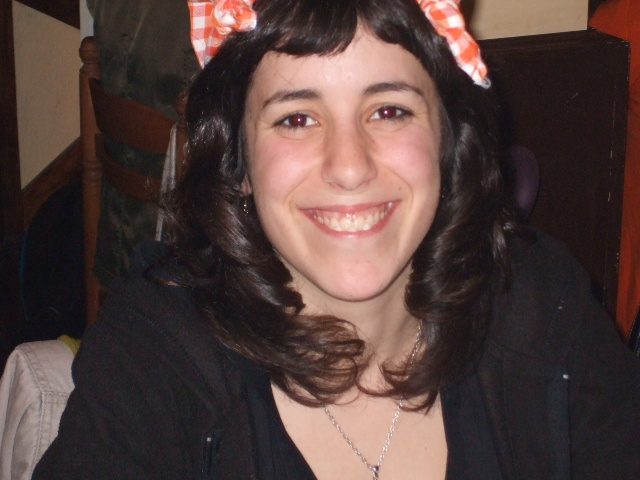 a  wearing a bow wearing a necklace