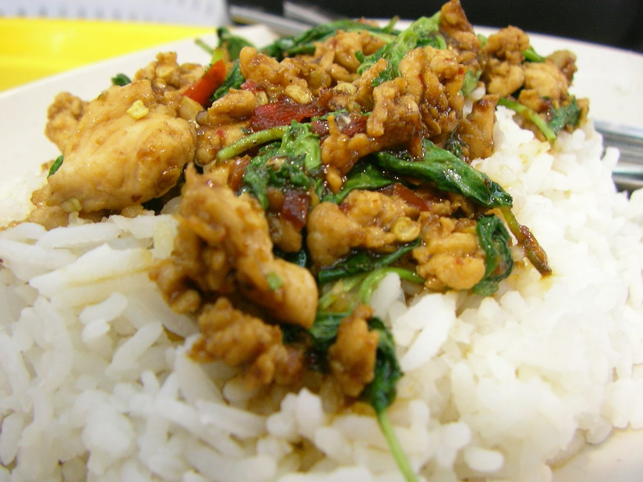 chicken, spinach and rice served on a plate