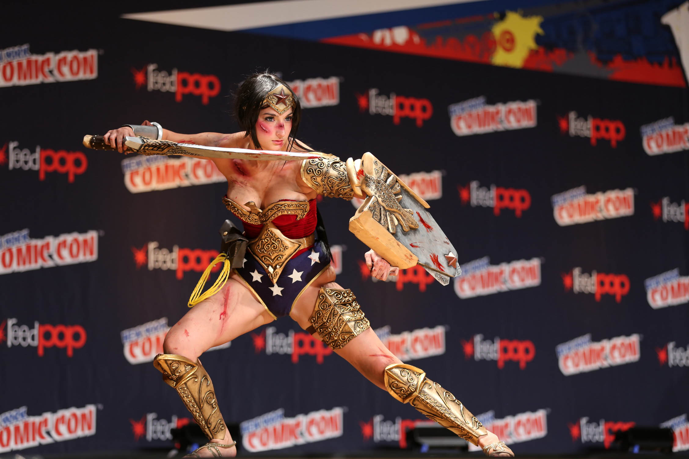a wonder woman is doing stunts on stage